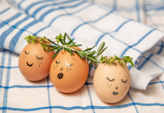 Easter eggs with cute face in green plant wreath. Sleepy easter egg - Home crafts happy haster concept.