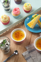 Variety of desserts on wooden table