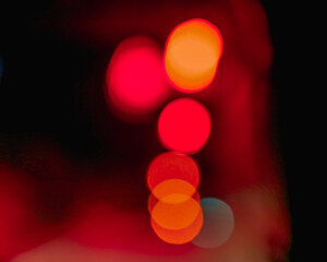 Beautiful colorful bokeh background.Long exposure light painting, curvy lines of different color in vibrant neon on black background. Red bokeh background. Modern background. Abstract.