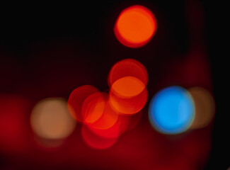 Beautiful colorful bokeh background.Long exposure light painting, curvy lines of different color in vibrant neon on black background. Red bokeh background. Modern background. Abstract.