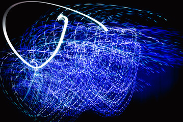 Beautiful colorful background.Long exposure light painting, curvy lines of different color in vibrant neon on black background. Glowing neon line designed background. Modern background. Abstract.