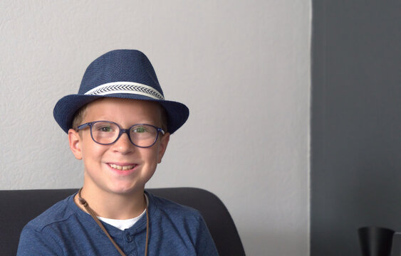 smiling boy with blue summer hat