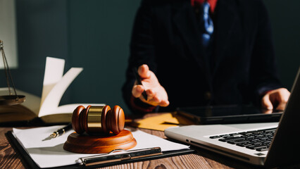 Business and lawyers discussing contract papers with brass scale on desk in office. Law, legal...