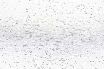 The idea of light reflecting on the surface of the water