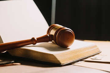 Business and lawyers discussing contract papers with brass scale on desk in office. Law, legal services, advice, justice and law concept picture with film grain effect