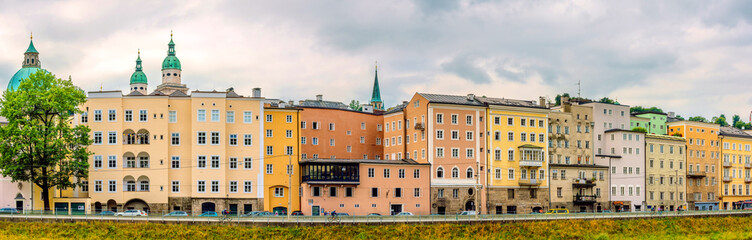 Fototapeta premium Historic colorful houses along the bank of the Salzach River, Salzburg, Austria.