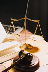 Business and lawyers discussing contract papers with brass scale on desk in office. Law, legal services, advice, justice and law concept picture with film grain effect