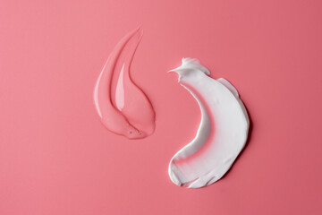 Set of different white and transparent cream smears on pink