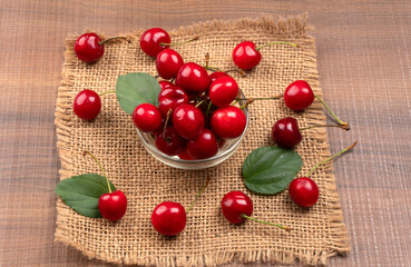 Fresh ripe cherries on wooden background