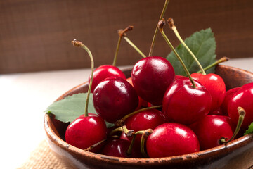 Fresh ripe cherries on wooden background