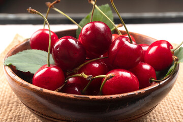 Fresh ripe cherries on wooden background