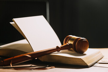 Business and lawyers discussing contract papers with brass scale on desk in office. Law, legal services, advice, justice and law concept picture with film grain effect