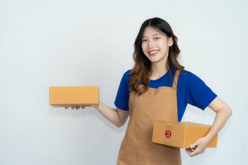 Young Asian woman holding a box with a charming smile Isolated on white background. Online SME business and delivery concept.