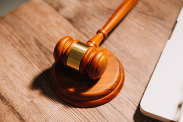 Obraz premium Business and lawyers discussing contract papers with brass scale on desk in office. Law, legal services, advice, justice and law concept picture with film grain effect
