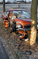Heavy car crash. Car hits tree. Netherlands. Eighties. Car wreck heavily damaged. Accident.