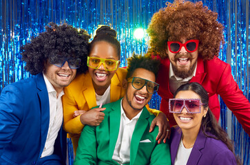 Happy cheerful joyful people wearing different bright yellow green, red, purple costumes, party...
