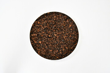 Roasted Chicory. Roasted Chicory chips, coarse cuts, pieces on white background. Instant coffee. Macro, close up, top view. tea ingredient. Organic. herbs. Dried Chicory. Dehydrated Chicory.