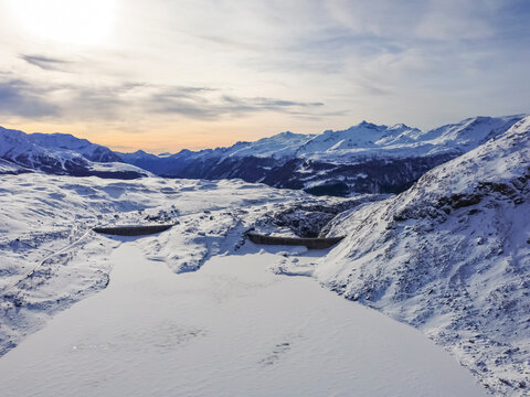 Lake Montespluga and its dam in winter