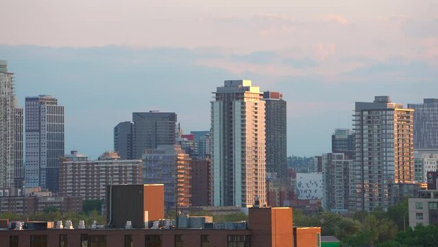 Beautiful buildings with warm skies sunset clouds in the evening in Calgary, Alberta, Canada cityscape