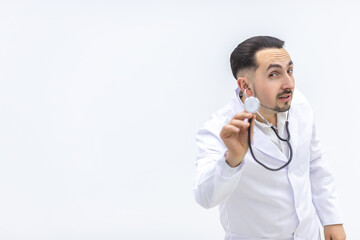 Close up photo of male mature doctor posing at camera with a stethoscope.