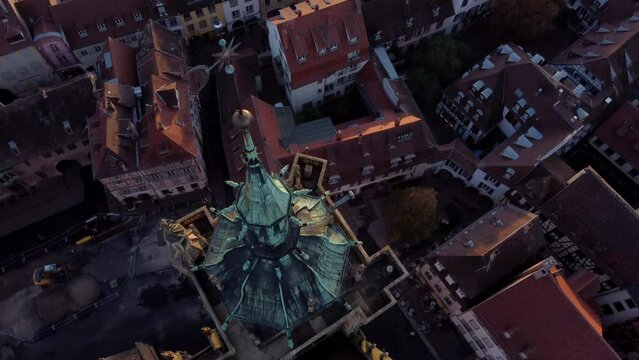 Drone Descending On Spire With Wind Vane On Top. St. Martin's Church In Colmar, France. aerial