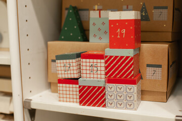 Christmas advent calendar gifts on sale on a shelf in home decor store. Giving gifts for kids....