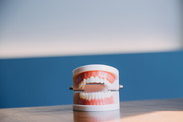 Stomatology concept, partial portrait of girl with strong white teeth looking at camera and smiling, fingers near face. Closeup of young woman at dentist's, studio, indoors
