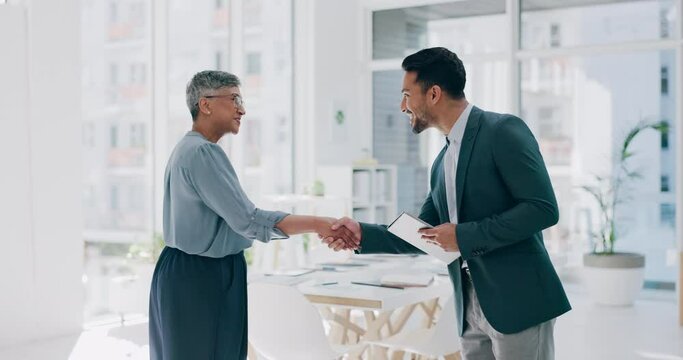 Businessman, woman and handshake in office for meeting, friendly welcome and smile for contract talk. Business people, shaking hands and business meeting for interview, recruitment and hr strategy