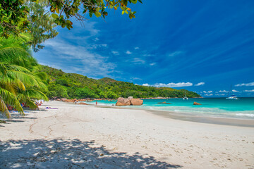 Praslin, Seychelles - September 2017: People along the beautiful beach on a sunny day