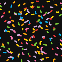 Donut glaze seamless pattern vector illustration. Doodle colorful sprinkles isolated on black. Bright confetti. Scribble spots. Childish print