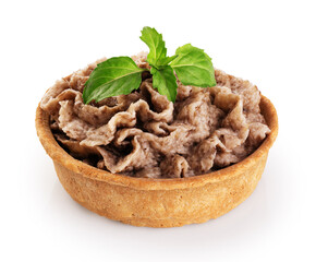 Tartlet with mushroom pate and basil isolated on white background. With clipping path.
