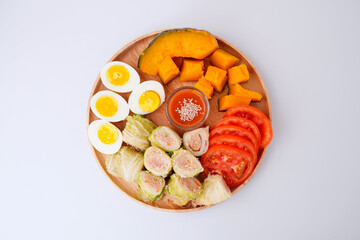 Healthy food Cabbage rolls stuffed with ground pork in a wooden tray white background top viwe