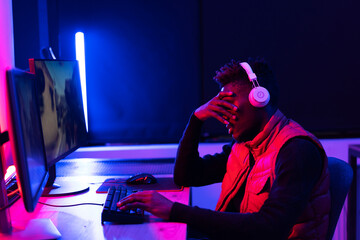 Software developer coding on his computer. Coding and hacking concept.