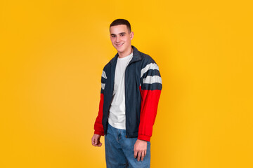 A handsome guy in the style of the 90s on a yellow background