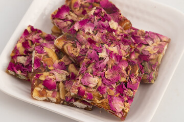 Rose Dry Fruit Chikki Also Called Gulab Til Gajak, Gazak, Gachak Are Sweet Brittle Candy Made Of Gud, Mungfali, Gur, Roasted Peanuts, Gulab Petals, Groundnut In Ghee. Makar Sankranti and Lohri Sweet