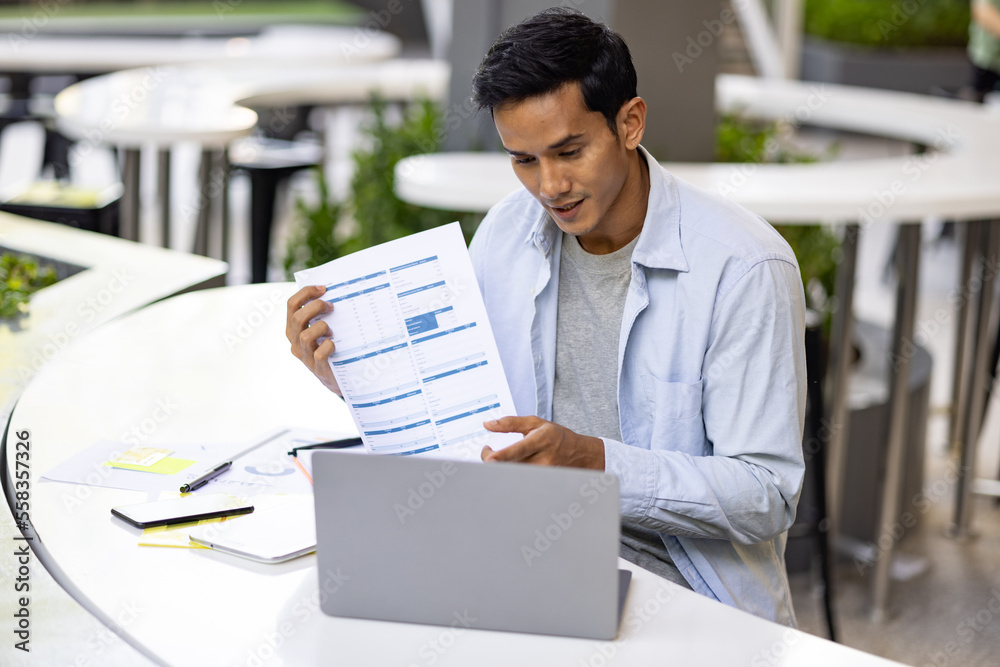 Wall mural asian  man in casual dress working in outdoor office. Concept for working and open office.