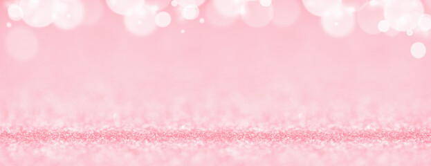 St Valentines day pink background top border wide banner. Love or wedding concept with bokeh lights glitter