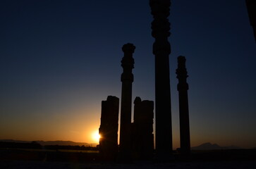 Fototapeta na wymiar ancient columns of Persepolis in sunset