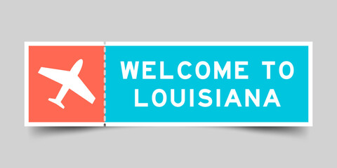 Orange and blue color ticket with plane icon and word welcome to louisiana on gray background