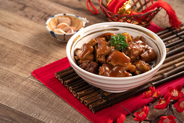 Taiwanese traditional food pork knuckle in a bowl for Chinese Lunar New Year meal.