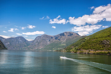 Port of Flam with tourist boat in the fjord, Norway