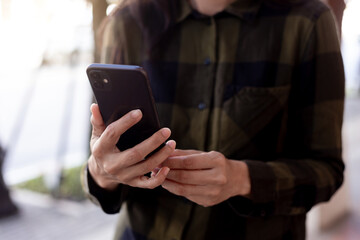 woman using cell phone hand holding mobile texting message contact us.chatting,search internet information.technology device communication connecting