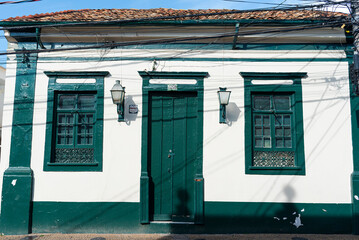 Naklejka premium old house with green door and windows in the Itu town in the State of Sao Paulo, Brazil