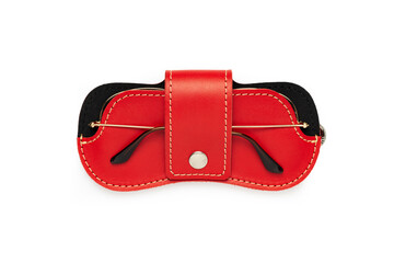 Red leather sunglasses case on a white background.