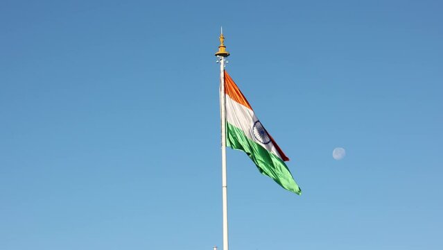 Indian flag flying Shimla India. Tricolor Flag of India with blue Sky in Background. capital of Himachal Pradesh north India Himalayas.  Near shopping street in Mall Road Ridge.