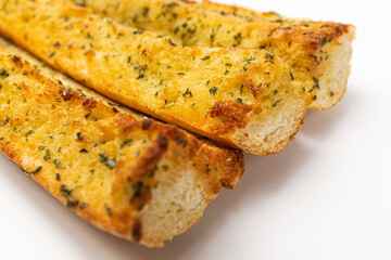 Garlic baguette sticks on a white background