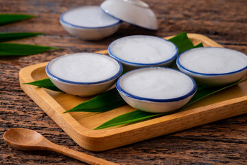 Coconut milk custard in small porcelain cup (Kanom Tuay), Thai dessert.