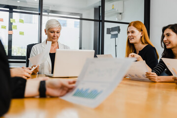 Mature 60s leader CEO company boss, Attractive aged businesswoman senior woman in meeting