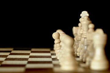 Chessmen. The pawn peeks out of the row.