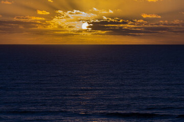 Colorful sunrise with clouds over the sea